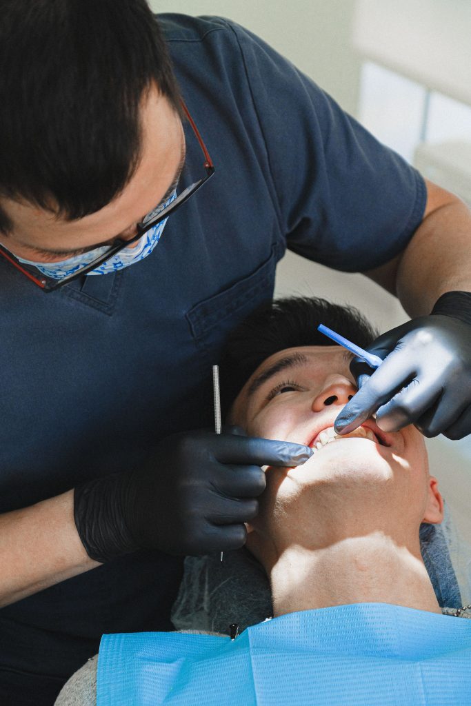 Smiling patient receiving care from a local dentist in a modern clinic