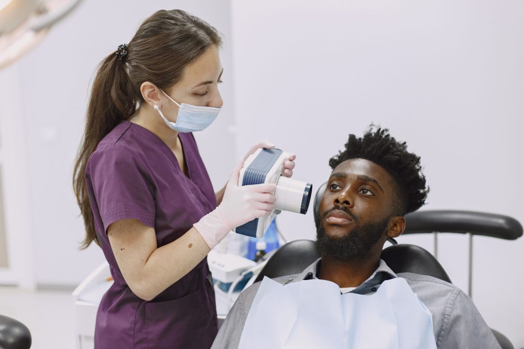 Dentist performing a checkup on a patient